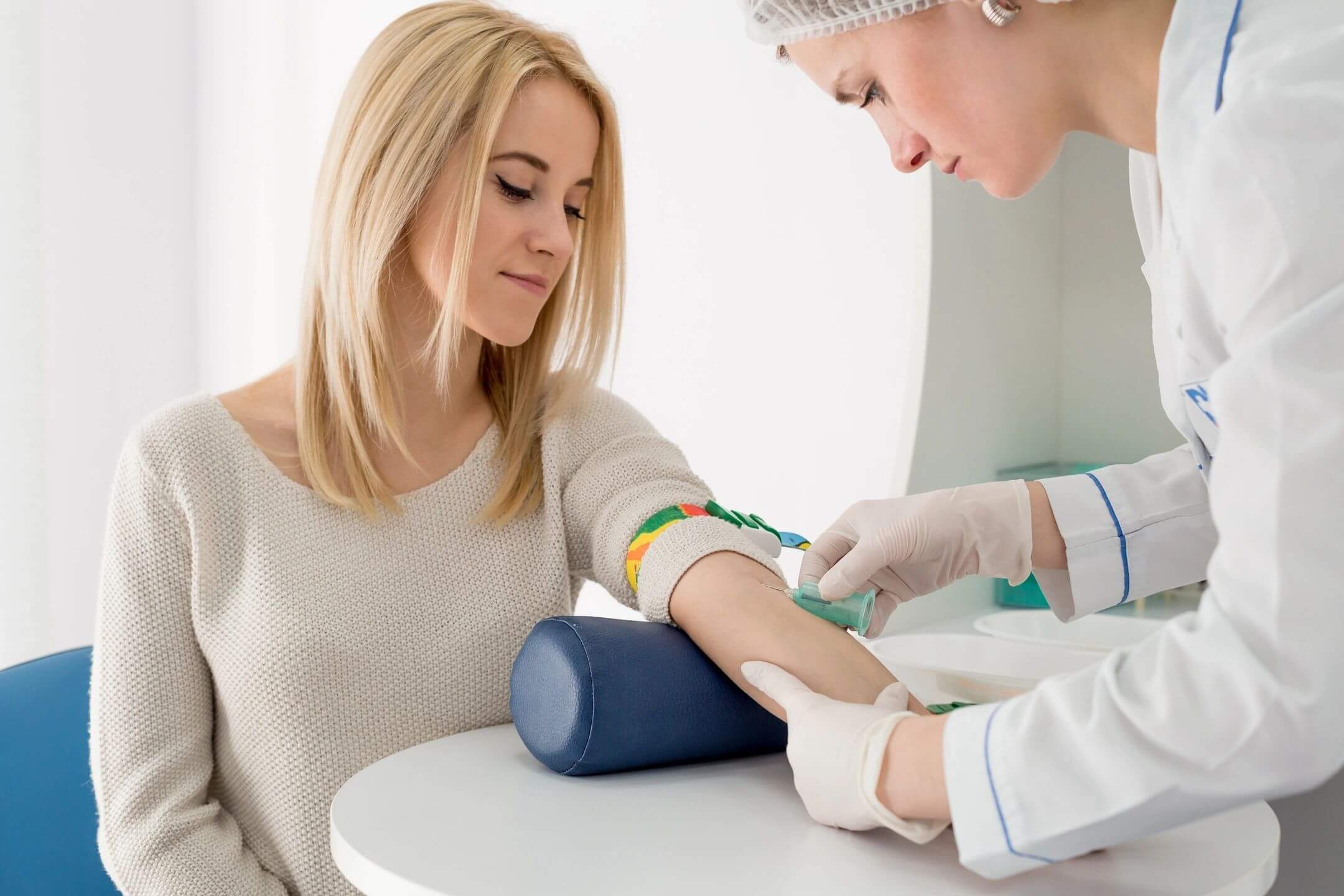 Nurse preparing patient for blood test.