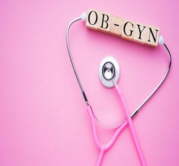 OB-GYN stethoscope on pink background.