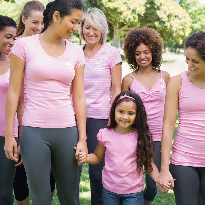 Group of women and girl wearing pink.